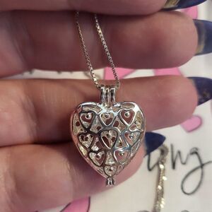 Sterling Silver Interlocking Heart Hinged Cage Pendant Necklace